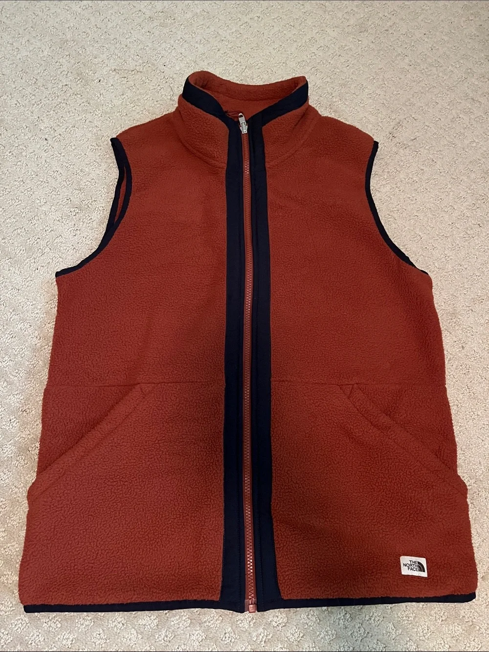 The North Face: Men's Burnt Orange Fleece Vest with Contrast Trim